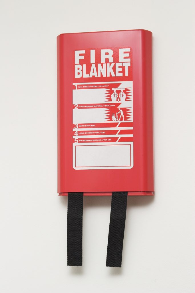 Wall mounted fire blanket. 