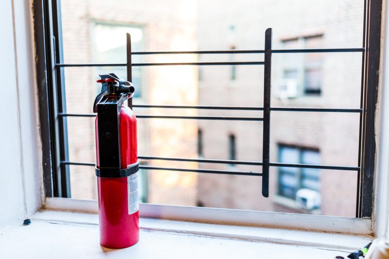 Small apartment with red fire extinguisher.